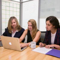 English lecturer Alice Staveley, left, meets with Stanford junior Emily Elott and second-year English doctoral candidate Anna Mukamal