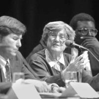 black and white photo of Eleanor Maccoby at a panel discussion