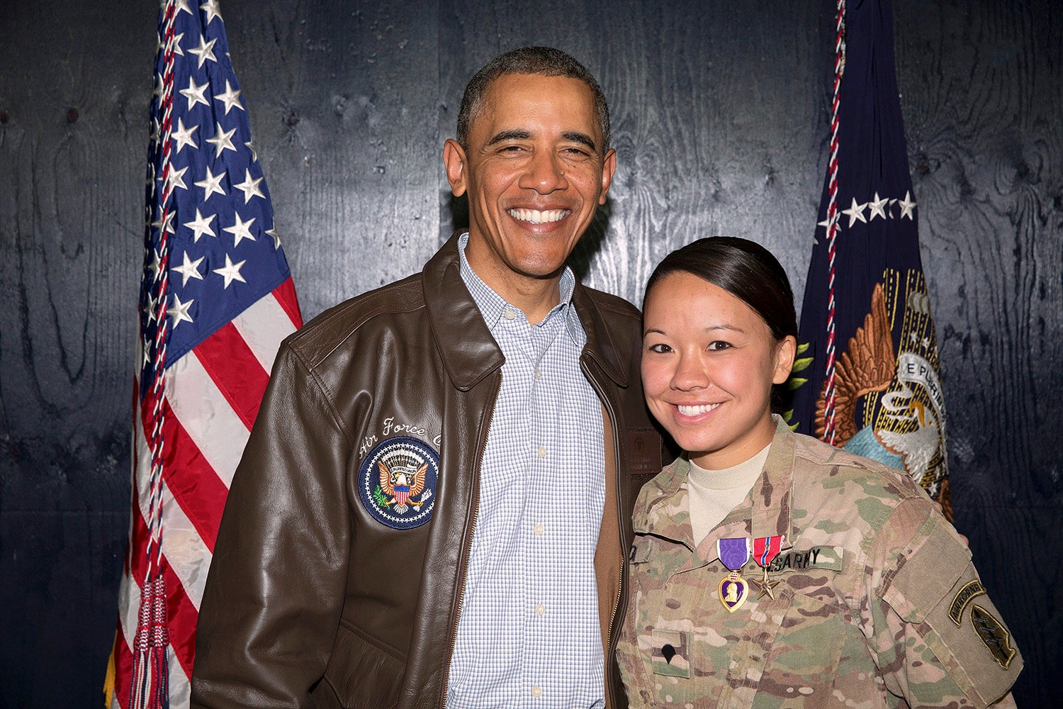 President Barack Obama with U.S. Army Sgt. Rachael Nicol. Obama awards medals to U.S. troops following his remarks to U.S. Troops at a rally at Bagram Airfield in Bagram, Afghanistan Sunday, May 25, 2014