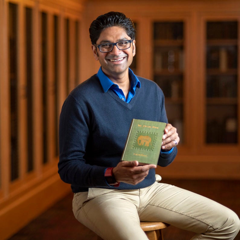 Krish Seetah with the 1894 American first edition of The Jungle Book