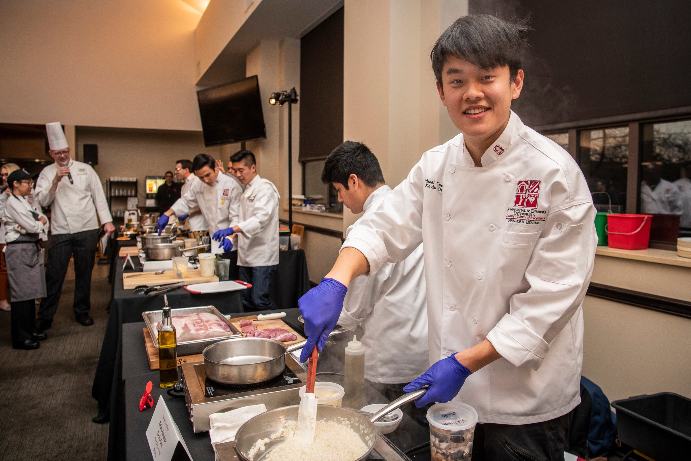 Kevin Guo, ’22, of Team Three prepares “ooo-baby pork chops” at the 16th annual Cardinal Cook-Off on Jan. 24 at the Arrillaga Family Dining Commons.