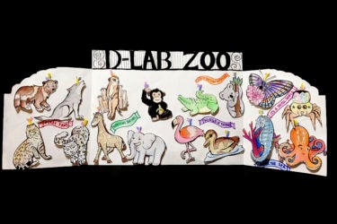 A card filled with drawn animal ornaments underneath a sign that says "D-Lab Zoo."