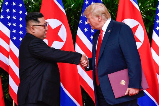 In this June 12, 2018, file photo, North Korea leader Kim Jong Un and U.S. President Donald Trump shake hands at the conclusion of their meetings at the Capella resort on Sentosa Island in Singapore. Trump and Kim are planning a second summit in the Vietnam capital of Hanoi, Feb. 27-28. (AP Photo/Susan Walsh, Pool, File)
