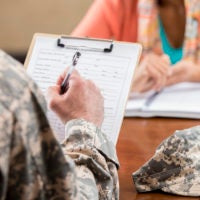 Military veteran filling out paperwork