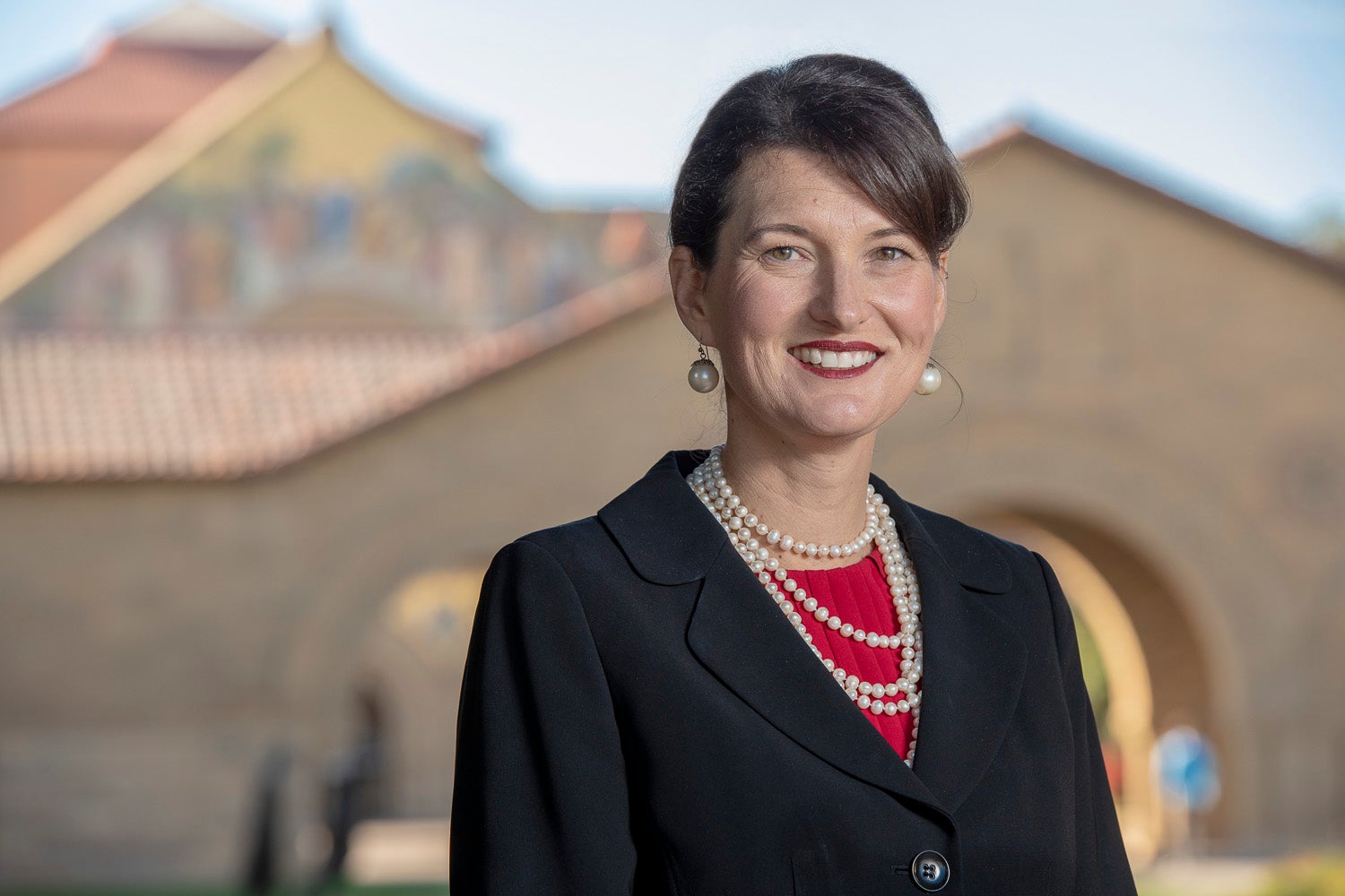 The Rev. Dr. Tiffany L. Steinwert, with Stanford Memorial Church in the background