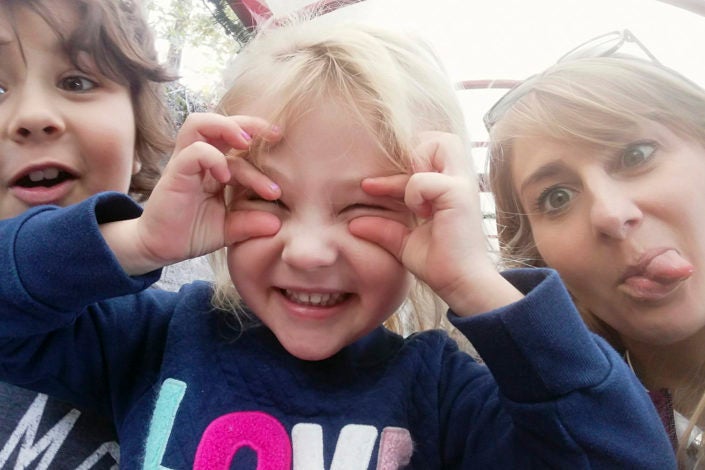 Eagleman and her kids making silly faces.