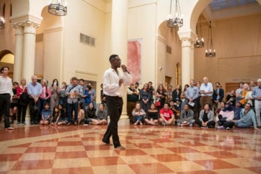 Aaron Grayson performs in the rotunda of Green Library