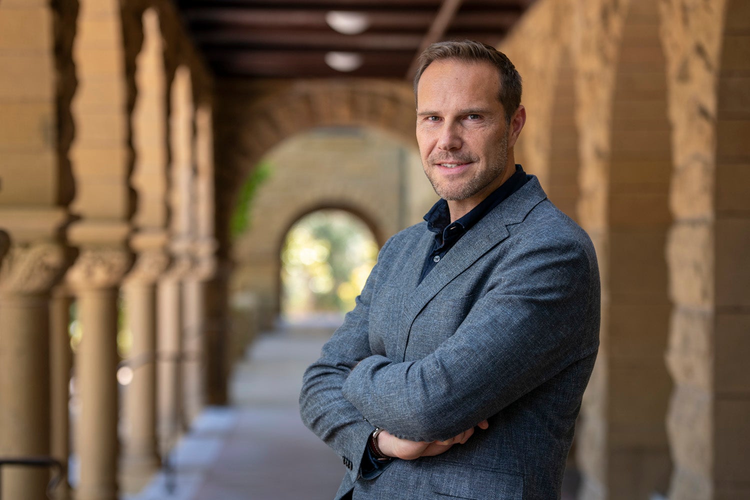 portrait of Jonathan Rodden in the arcades of the Stanford Quad
