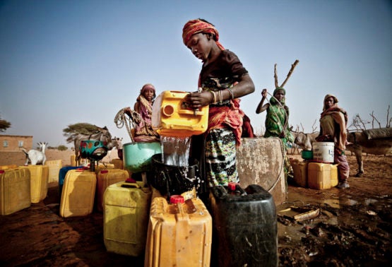 Fari Awade draws water from a well in the community of Natriguel, Mauritania.