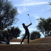 golfer taking a swing