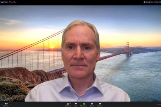 Marc Tessier-Lavigne in front of a screen showing the Golden Gate Bridge