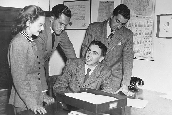 Warren Christopher '49 (sitting), the Stanford Law Review's first president, discusses plans with Shirley Mount Hufstedler '49, article and book review editor; Arthur Miller '49, case editor; and Malcolm Dungan '49 (BA '47), note editor.