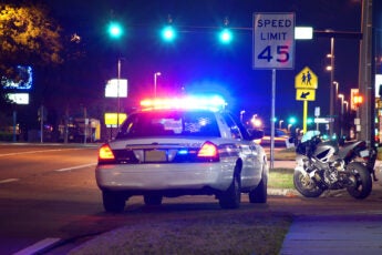Motorcycle pulled over at night for a police traffic stop