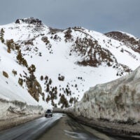 HOPE VALLEY, CA - APRIL 8: Canyons of snow greet drivers on Highway 88 as they cross the Sierra Nevada Crest over Carson Pass on April 8, 2022, near South Lake Tahoe, California. With record snow of 20-40 feet in many places this winter, communities in the Sierra Nevada are still digging out even as the temperatures rise and the snow begins to melt. (Photo by George Rose/Getty Images)