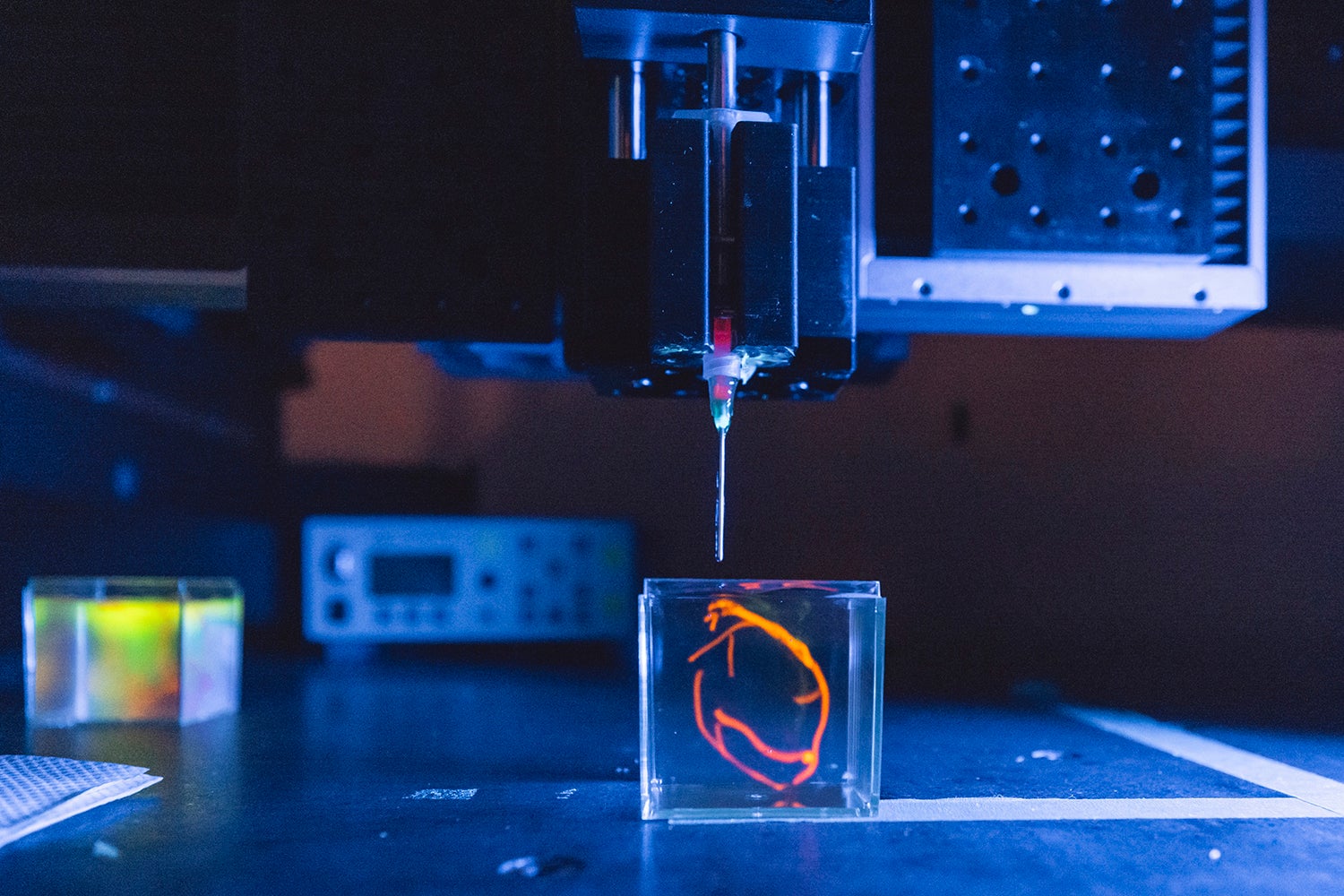 A 3D bioprinter in the Skylar-Scott lab prints a sample of heart tissue in 2022.
